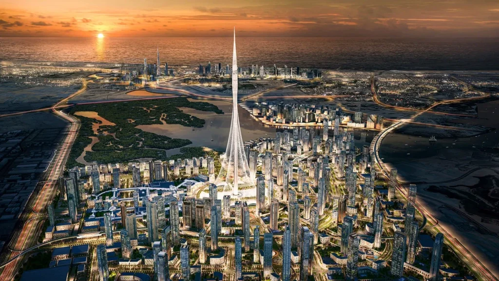 Artistic rendering of the future Dubai Creek Tower landmark surrounded by the master community of Dubai Creek Harbour at sunset.